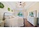 Tranquil bedroom with tray ceilings, wood floors, pool view, and elegant furnishings at 5102 Pheasant Woods Dr, Lutz, FL 33558
