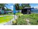 Gazebo and green pool in a backyard at 5106 Town N Country Blvd, Tampa, FL 33615