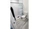 Bathroom featuring a tiled stand up shower with a white toilet at 5106 Town N Country Blvd, Tampa, FL 33615