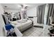 Bedroom with tiled floors and ample space featuring a sliding door closet and a door leading outside at 5106 Town N Country Blvd, Tampa, FL 33615