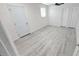 This bedroom features hardwood flooring, a ceiling fan, and a window allowing natural light to enter the room at 5106 Town N Country Blvd, Tampa, FL 33615