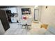 Modern dining room featuring a glass table and white chairs at 5106 Town N Country Blvd, Tampa, FL 33615