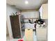 This kitchen features white cabinetry, stainless steel appliances, and ample counter space at 5106 Town N Country Blvd, Tampa, FL 33615