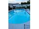 This backyard features a spacious in-ground pool with refreshing water and some yard decorations at 5106 Town N Country Blvd, Tampa, FL 33615