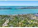 Expansive aerial view of a coastal community with stunning waterfront and city skyline in the distance at 5518 21St S Ave, Gulfport, FL 33707