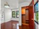 Bedroom featuring dark hardwood floors, lots of natural light and an open closet at 5518 21St S Ave, Gulfport, FL 33707