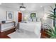 Cozy bedroom featuring a comfortable bed, soft lighting, and hardwood floors at 5518 21St S Ave, Gulfport, FL 33707