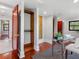 Bright bedroom with refinished hardwood floors, an open closet, and a glass desk near the window at 5518 21St S Ave, Gulfport, FL 33707
