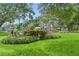 Charming Gulfport Historic Waterfront sign surrounded by lush greenery and mature trees in Clymer Park at 5518 21St S Ave, Gulfport, FL 33707