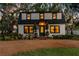 Charming two-story home with a gambrel roof, a welcoming front yard, and stylish curb appeal at 5518 21St S Ave, Gulfport, FL 33707