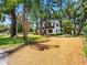 Charming two-story home with a gravel driveway and lush landscaping in a desirable neighborhood at 5518 21St S Ave, Gulfport, FL 33707