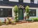 Charming front door with decorative plants and elegant exterior features at 5518 21St S Ave, Gulfport, FL 33707