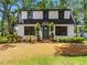 Charming home featuring a well-manicured front yard and an arched entryway at 5518 21St S Ave, Gulfport, FL 33707