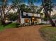 Charming home with gravel driveway, lush landscaping, and a welcoming front facade at 5518 21St S Ave, Gulfport, FL 33707