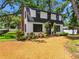 Charming home featuring a well-manicured front yard, front door and a brick chimney at 5518 21St S Ave, Gulfport, FL 33707