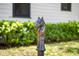 Close-up of a decorative horse head hitching post with a white house in the background at 5518 21St S Ave, Gulfport, FL 33707