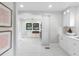 Bright, white kitchen featuring white cabinets, stainless steel appliances, and black trimmed window at 5518 21St S Ave, Gulfport, FL 33707