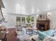 Inviting living room with fireplace, comfortable seating, hardwood floors, and abundant natural light at 5518 21St S Ave, Gulfport, FL 33707