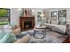 Bright and inviting living room features a fireplace, hardwood floors, and comfortable seating arrangements at 5518 21St S Ave, Gulfport, FL 33707