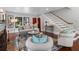 Bright living room with hardwood floors, area rug, comfortable seating and stairway at 5518 21St S Ave, Gulfport, FL 33707