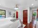 Bedroom featuring hardwood floors, white walls, dark window frames, and a cozy bed at 5518 21St S Ave, Gulfport, FL 33707