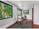 Office with large windows offering views of mature trees and a black-and-white rug at 5518 21St S Ave, Gulfport, FL 33707