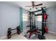 Home gym features modern fitness equipment, tile flooring, and lots of space at 5519 Kelly N Dr, St Petersburg, FL 33703