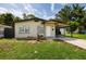Charming single-story home with a carport and well-maintained lawn at 5519 Kelly N Dr, St Petersburg, FL 33703