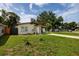 Single-story home with carport and front lawn at 5519 Kelly N Dr, St Petersburg, FL 33703