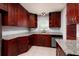 Kitchen featuring ample counter space, dark cabinets, and modern appliances at 5519 Kelly N Dr, St Petersburg, FL 33703