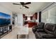 Open-concept living area with a view into the kitchen and comfortable seating at 5519 Kelly N Dr, St Petersburg, FL 33703