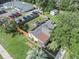 Aerial view of a fenced property featuring green spaces and a well-maintained exterior at 5651 6Th St, Zephyrhills, FL 33542