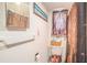 Functional bathroom with white fixtures, and novelty shower curtain and toilet seat cover at 5651 6Th St, Zephyrhills, FL 33542