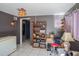 Spacious bonus room with tile flooring and shelving at 5651 6Th St, Zephyrhills, FL 33542