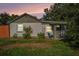 Quaint single-story home with neutral paint, updated windows, and a charming front porch at 5651 6Th St, Zephyrhills, FL 33542