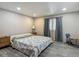 Charming bedroom offers natural light, wood-style flooring, and neutral paint at 5806 Portsmouth Dr, Tampa, FL 33615