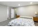 Clean bedroom features wood-style flooring, a dresser, and two bedside tables at 5806 Portsmouth Dr, Tampa, FL 33615