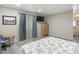 Bright and airy bedroom boasts a large window, wood floors, and warm-toned accents at 5806 Portsmouth Dr, Tampa, FL 33615