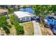 Charming single-story home with a long driveway, boat on the side, and well-maintained lawn at 5806 Portsmouth Dr, Tampa, FL 33615