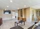 Open-concept living room with wood laminate floors, modern fixtures, and plenty of space at 5806 Portsmouth Dr, Tampa, FL 33615