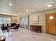 Spacious living room with modern flooring, comfortable seating, and natural light at 5806 Portsmouth Dr, Tampa, FL 33615