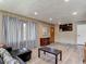 Living room with wood laminate flooring and natural light at 5806 Portsmouth Dr, Tampa, FL 33615