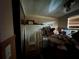 Bedroom with a ceiling fan and a window, piled with furniture and boxes at 5853 39Th St N, St Petersburg, FL 33714