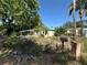 Quaint home with a well-maintained lawn, framed by mature trees and a classic mailbox at 5853 39Th St N, St Petersburg, FL 33714
