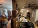 View of an outdated kitchen and breakfast bar with cluttered countertops and vintage decor at 5853 39Th St N, St Petersburg, FL 33714