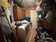 Laundry room featuring a washer and dryer, wood paneled walls, and storage shelves at 5853 39Th St N, St Petersburg, FL 33714