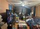 Spacious living room with a vintage TV and cluttered interior at 5853 39Th St N, St Petersburg, FL 33714
