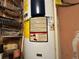 Close-up of a water heater with visible labels and warning signs, inside the home at 5853 39Th St N, St Petersburg, FL 33714