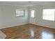 Clean and spacious living room with modern floors, lots of natural light and neutral color palette at 6144 Elmhurst Dr, New Port Richey, FL 34653