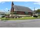 Welcoming community recreation center featuring beautiful brick facade and manicured landscaping at 6144 Elmhurst Dr, New Port Richey, FL 34653